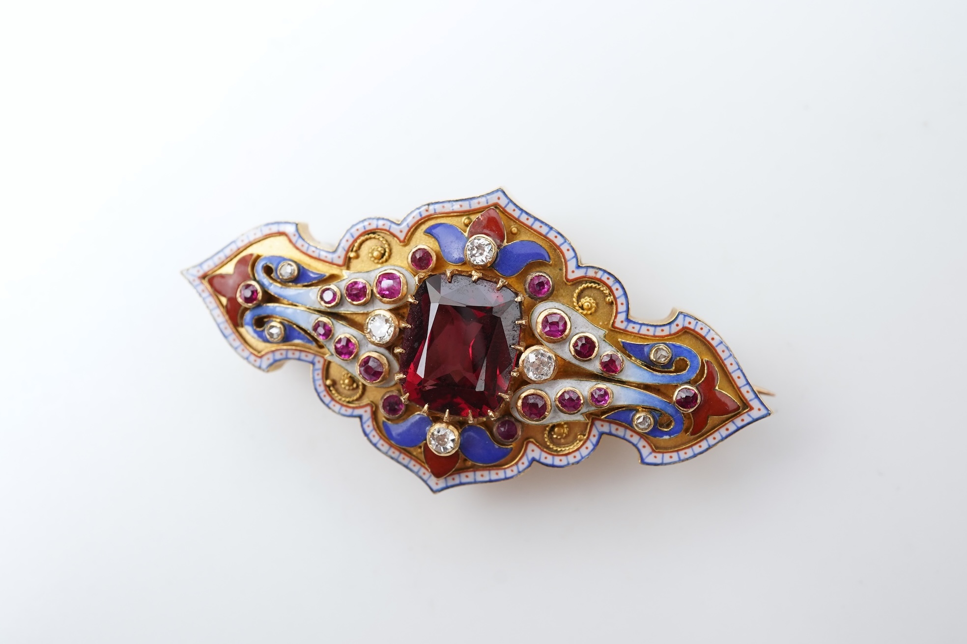 A fine Victorian Renaissance Revival tourmaline, diamond, ruby and enamel brooch, late 19th century